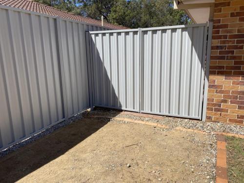 Grey colorbond fence and gate